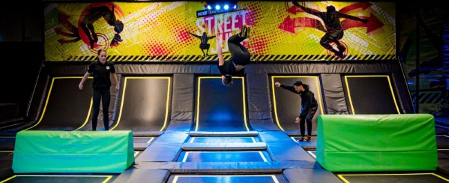 freestyle trampoline stunts in street jump zone